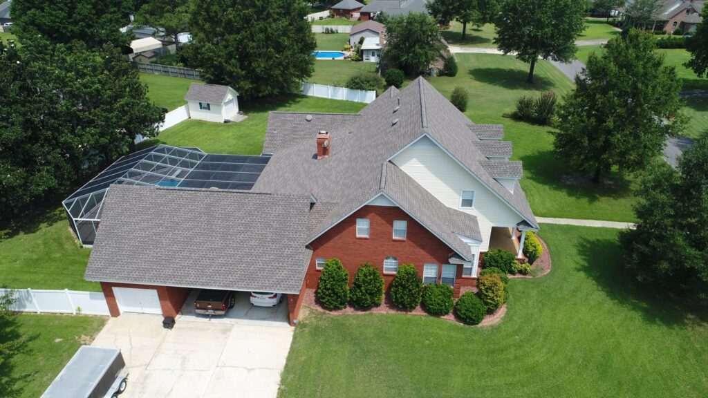 aerial view of home with asphalt shingles