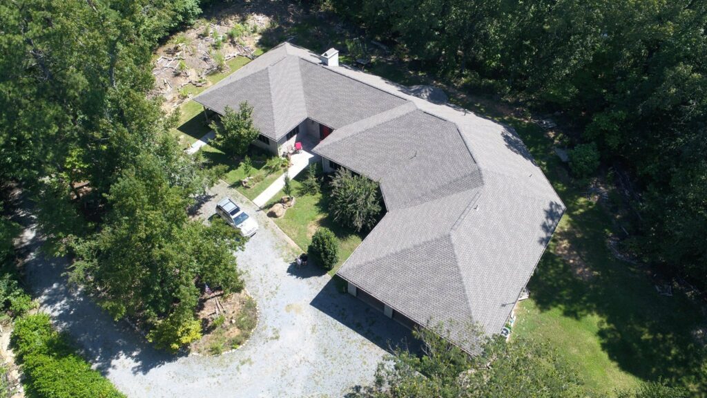 aerial view of home with asphalt shingles