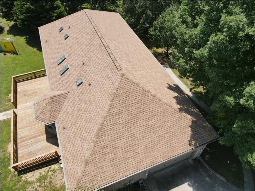 aerial view of home with roof shingles