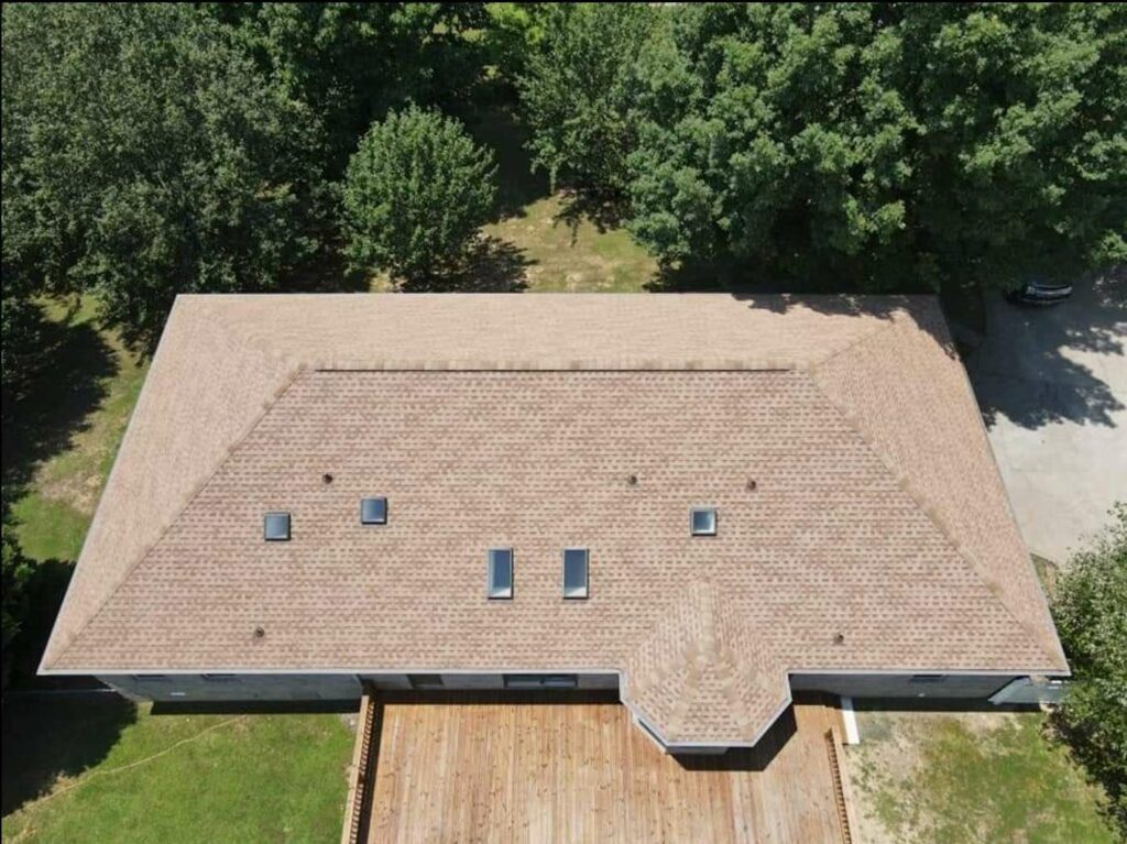 aerial view of home with roof shingles