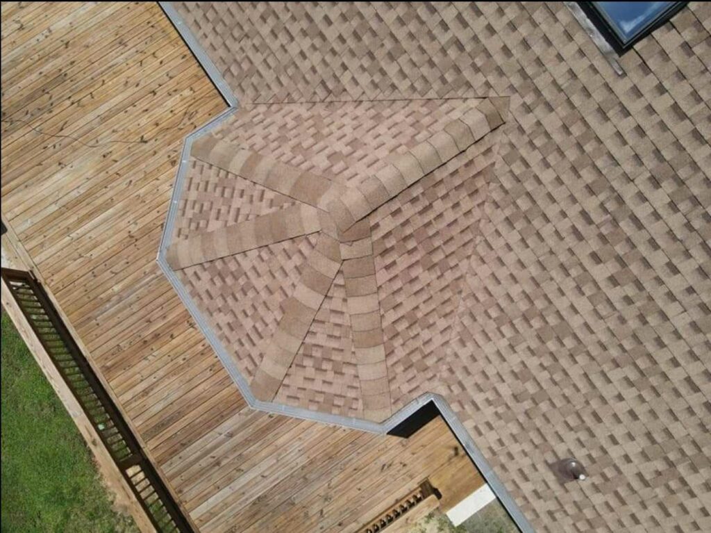 aerial view of home with roof shingles