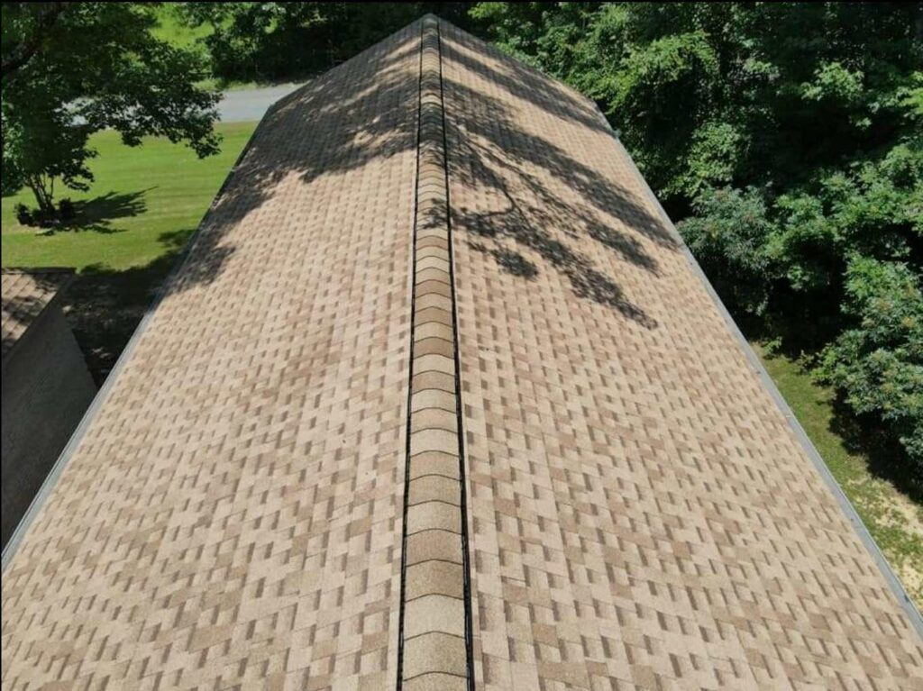 aerial view of home with roof shingles