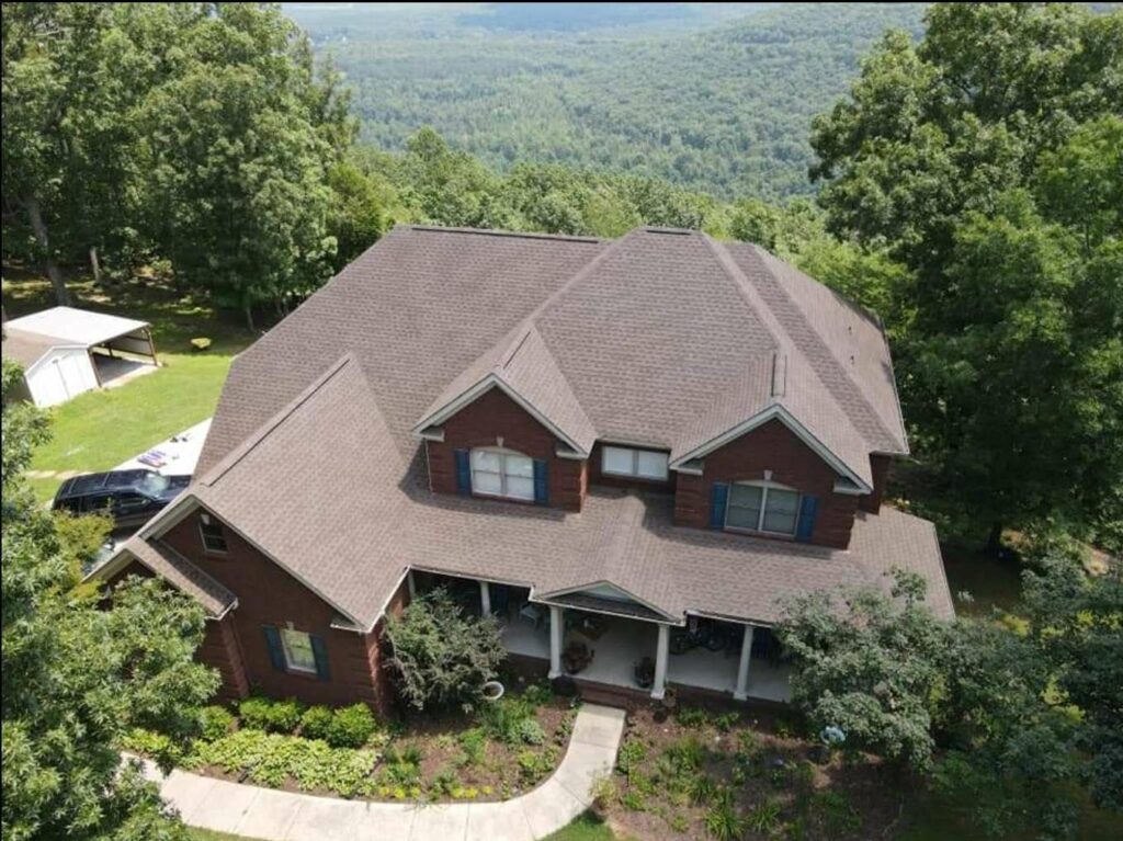 aerial view of home with roof shingles