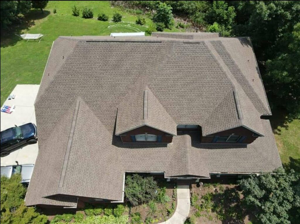 aerial view of home with roof shingles