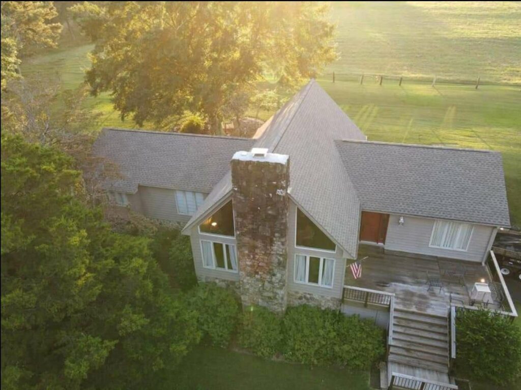 aerial view of home with roof shingles