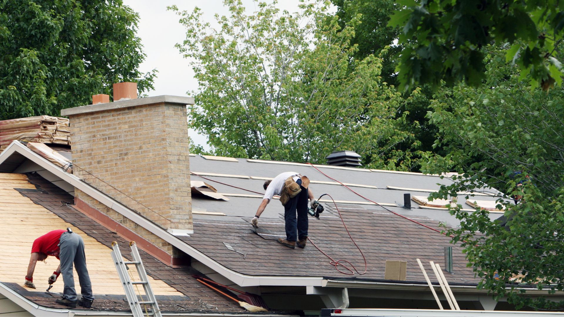roofers working on residential roof repairs